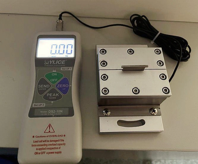 Set-up for measuring the impact force of the water jet for determining