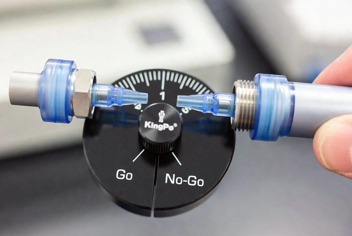 ISO 80369-7 Go/No-Go Luer Gauge performing compliance test on medical connector.
