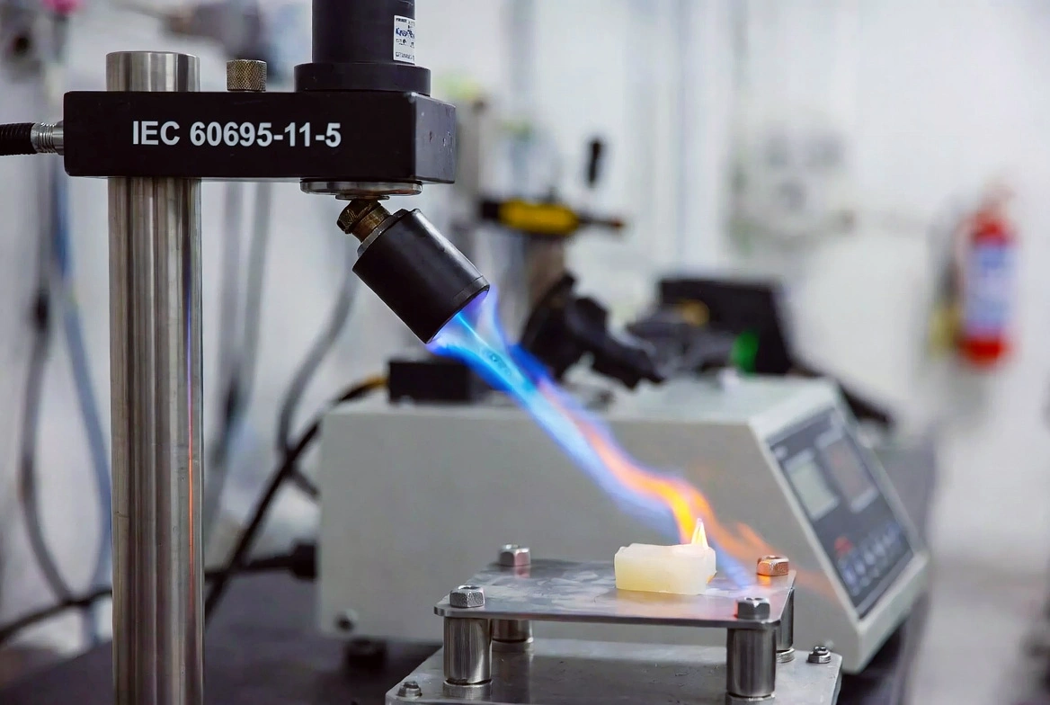 Needle Flame Tester applying calibrated flame per IEC 60695-11-5.