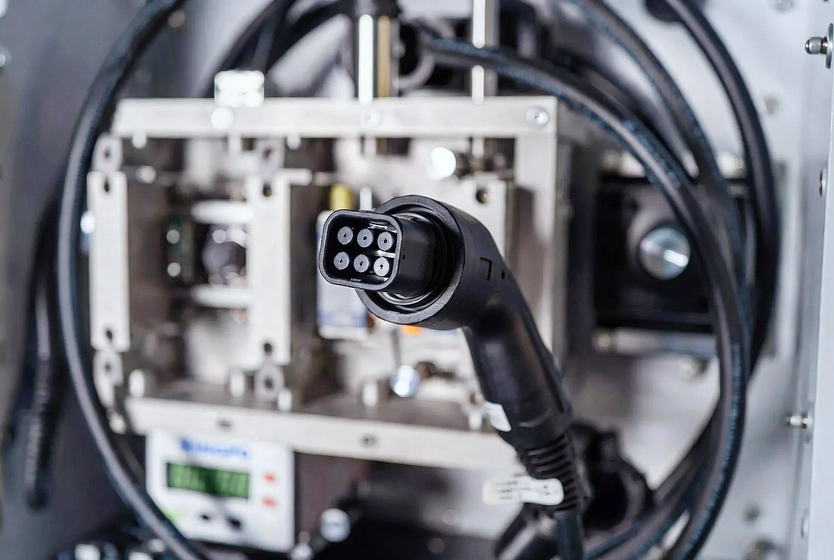 How to Test an EV Charger: Complete Guide to IEC 61851-23 & UL 2251 Compliance 2 4:3 landscape close-up of the 7-inch color touchscreen control panel on KingPo EV charger tester equipment. Screen displaying real-time force, torque, cycle count and test parameters in clear English menu, modern UI design, sharp focus, professional technical detail photography.