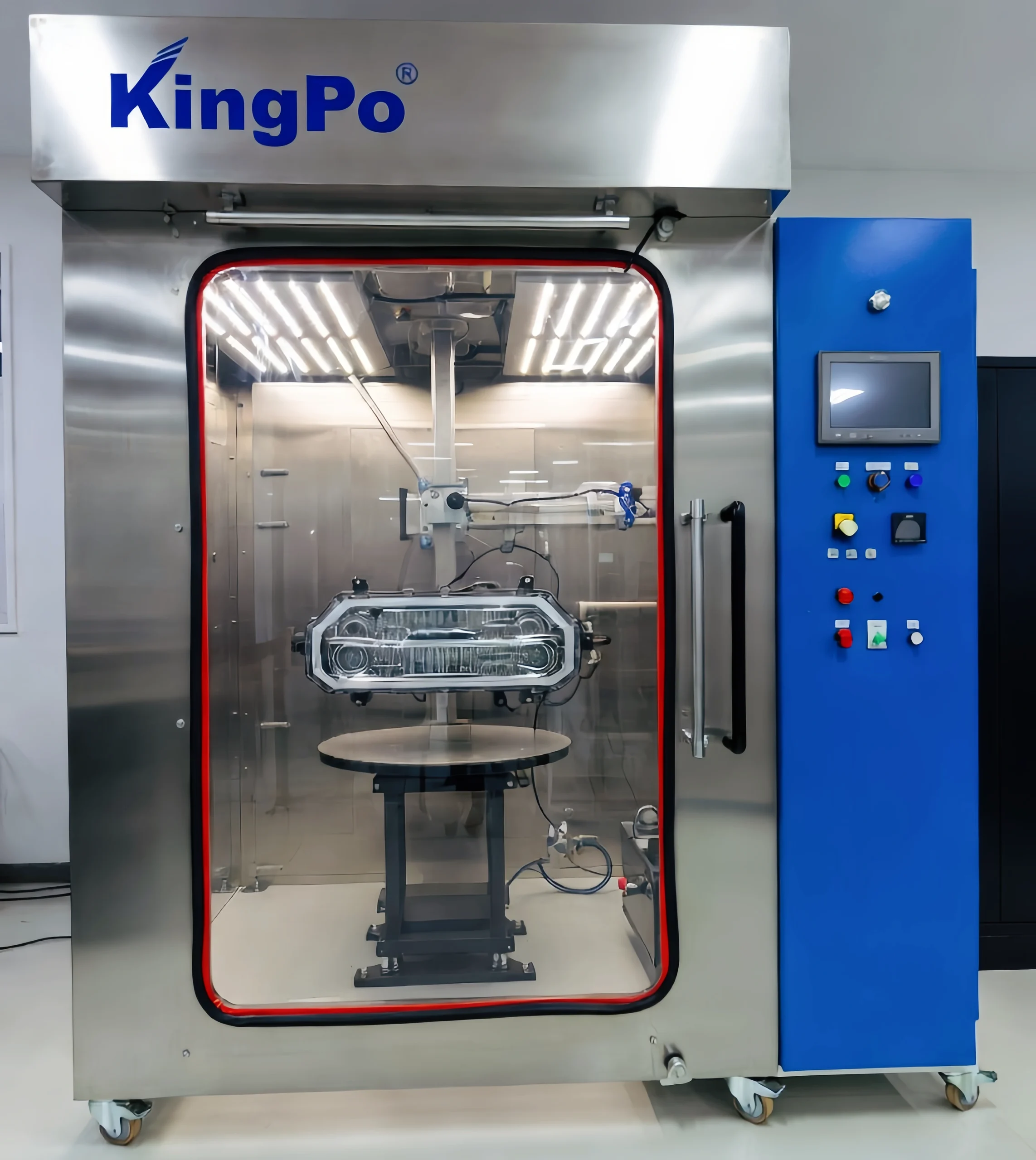How to Perform Rain Spray Test Chamber Testing for JIS D0203 Automotive Waterproof Compliance? 1 Modern KingPo Rain Spray Test Chamber in a clean, well-lit laboratory, full view showing the glass door, blue control panel, turntable inside, and stainless steel construction, professional blue-grey color scheme, bright LED lighting, realistic photo style.