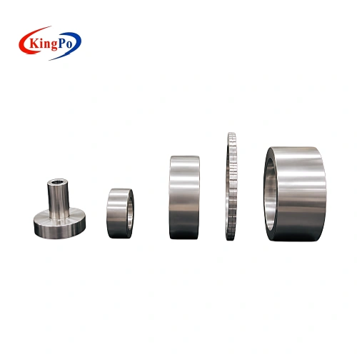Stainless steel protrusion test gauge kit for ISO 8124-1:2014 Clause 6.7.1.2, shown in an alternative arrangement highlighting the compact cylindrical probe alongside precision-machined rings of increasing size.