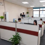 KingPo employees working in the office workspace