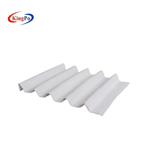 Wave-folded cellulose paper placed on dark laboratory work surface for glow wire fire hazard evaluation