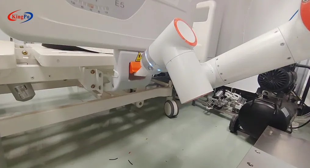 6-axis robotic arm simulating repeated side rail operation for medical bed latch reliability testing