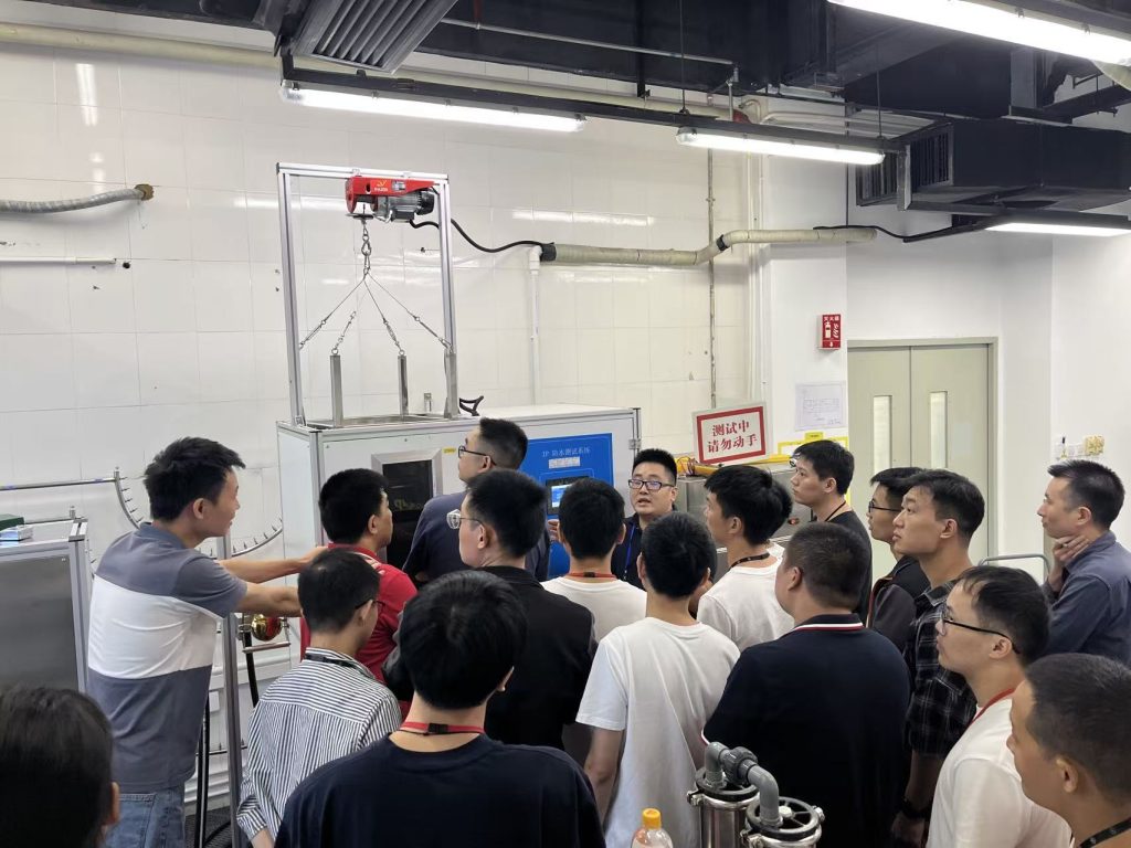 Successful Delivery of IP Testing Equipment & UL Rain Testing System for UL Certification Laboratory in Guangzhou 1 UL IP waterproof testing system training session for IEC 60529 IPX testing at certification laboratory with engineers observing KINGPO equipment demonstration