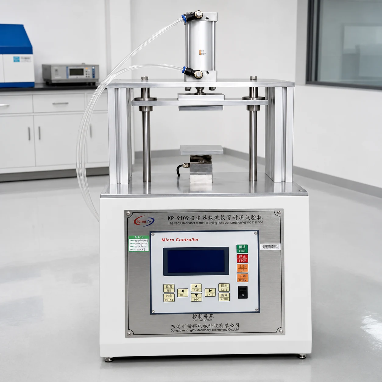 Current-carrying hose crushing tester used in a laboratory for IEC 60335-2-2 testing