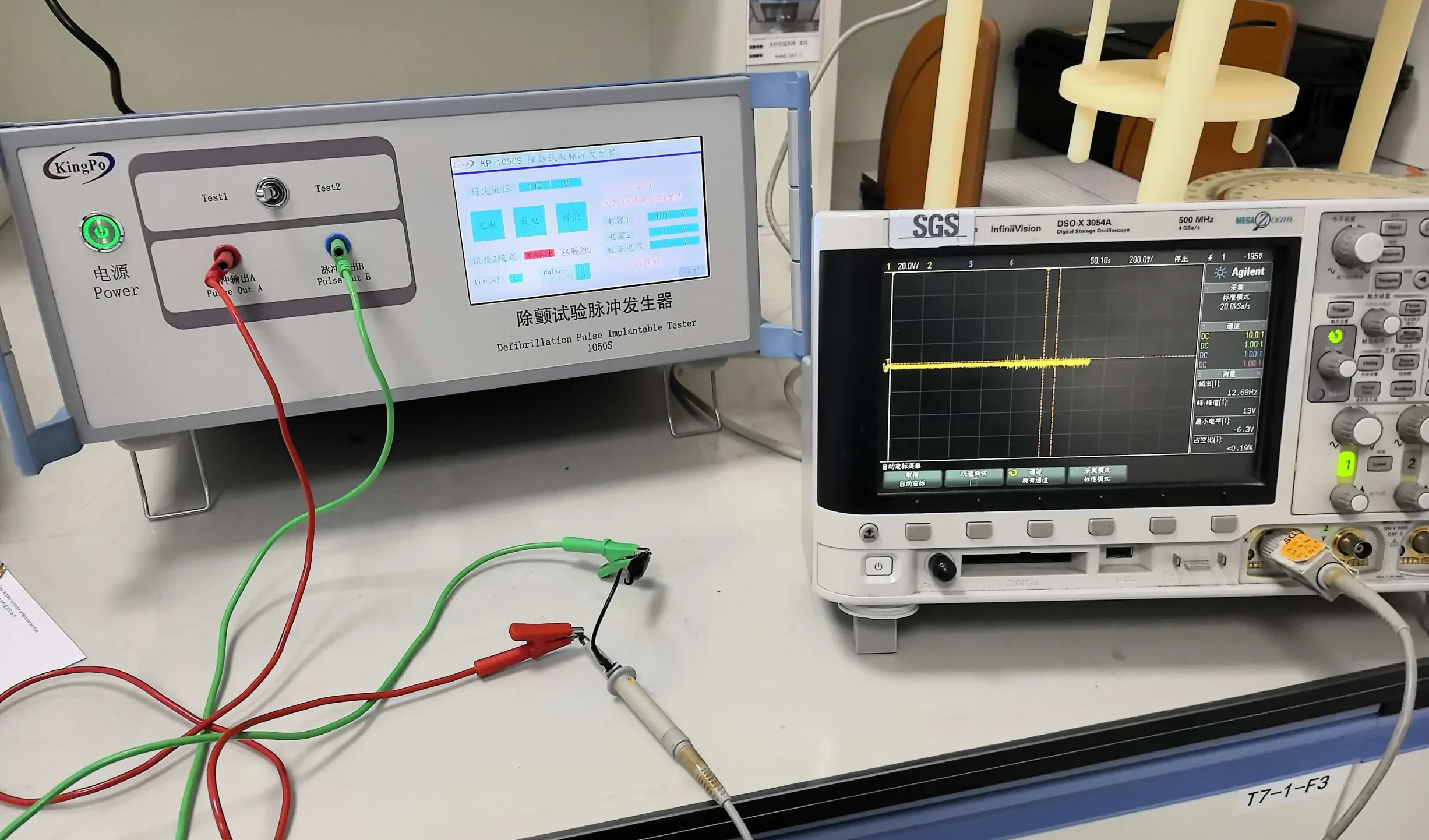KingPo Supplies KP-1050S Defibrillation Test Pulse Generator to NeuroPace in the United States 1 KingPo KP-1050S defibrillation test pulse generator connected to an oscilloscope for AIMD immunity testing