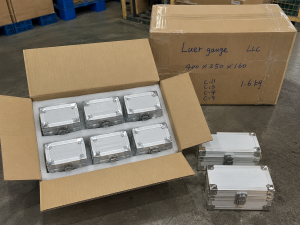 KingPo Supplies ISO 80369-7 Luer Reference Gauges to AngioSystems LLC in Russia 1 Close-up product display of a stainless steel luer gauge with machined body, connector tip, and protective case.
