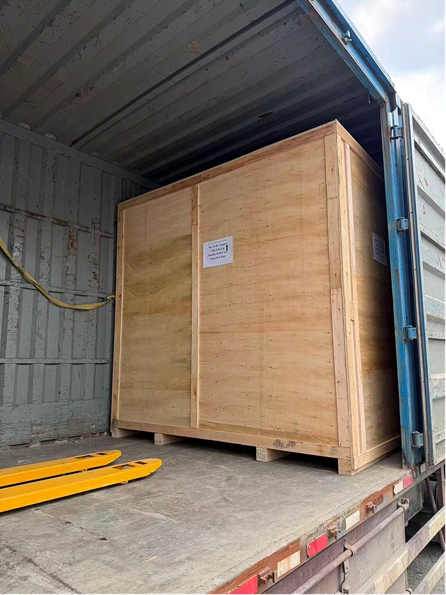 KingPo Ships JIS D0207 F2 Dust Chamber to Automotive Testing Organization in Indonesia 5 Wooden shipping crate containing the KingPoJIS D0207 F2 Dust Chamber positioned inside a shipping container for transportation.