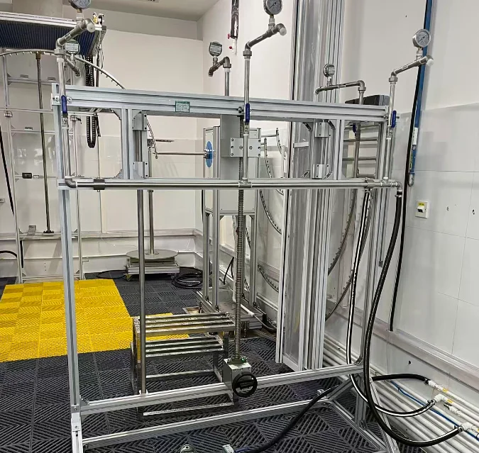 UL Mexico Visits KINGPO for Technical Exchange on Automotive IP Testing 3 An IP water ingress testing setup featuring a structural test frame, water supply piping and pressure gauges for enclosure protection evaluation.